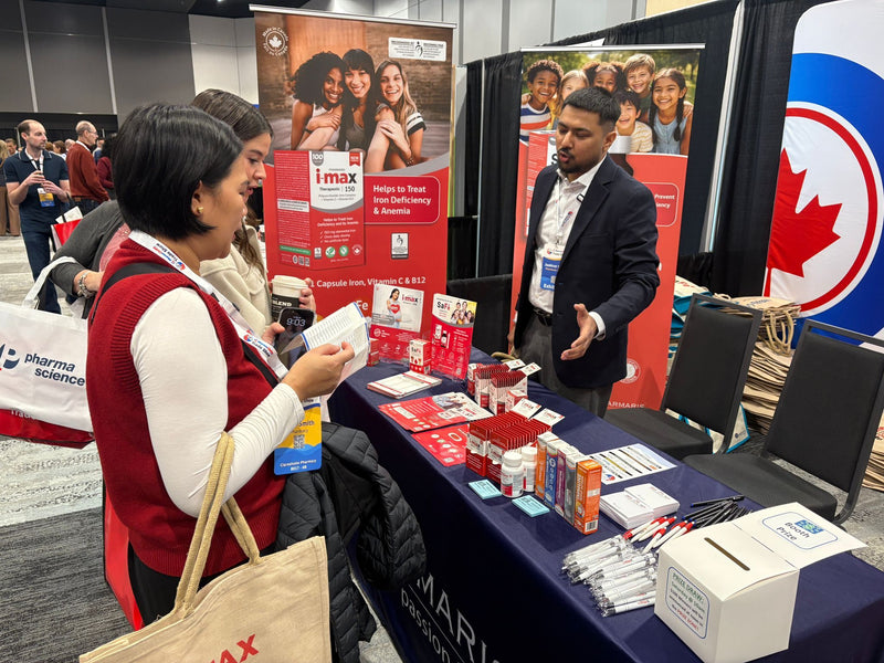 A Medical Representative talking with a pharmacy professional at Booth #110