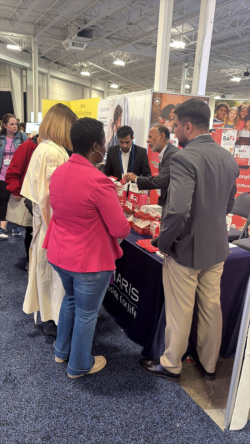 Medical Representatives with visitors at the Pharmaris stand at Pri-Med Canada